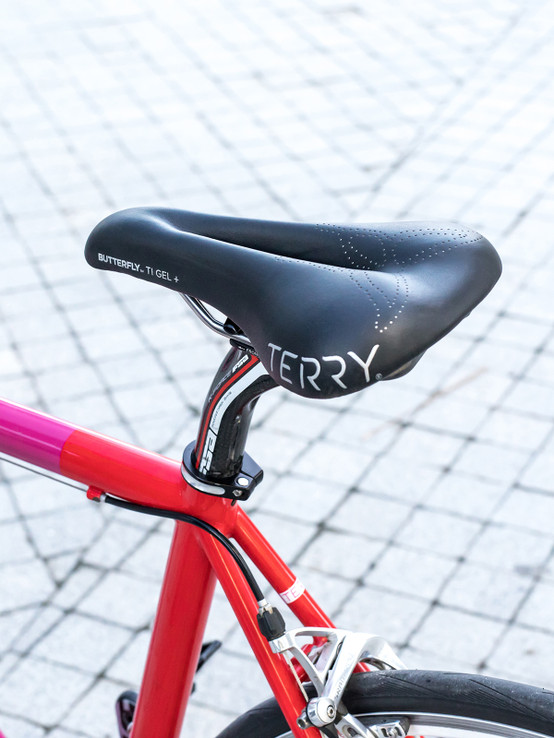Terry Women's Butterfly Ti Gel + Bike Saddle in the Colorway Black, Side View, On Bike